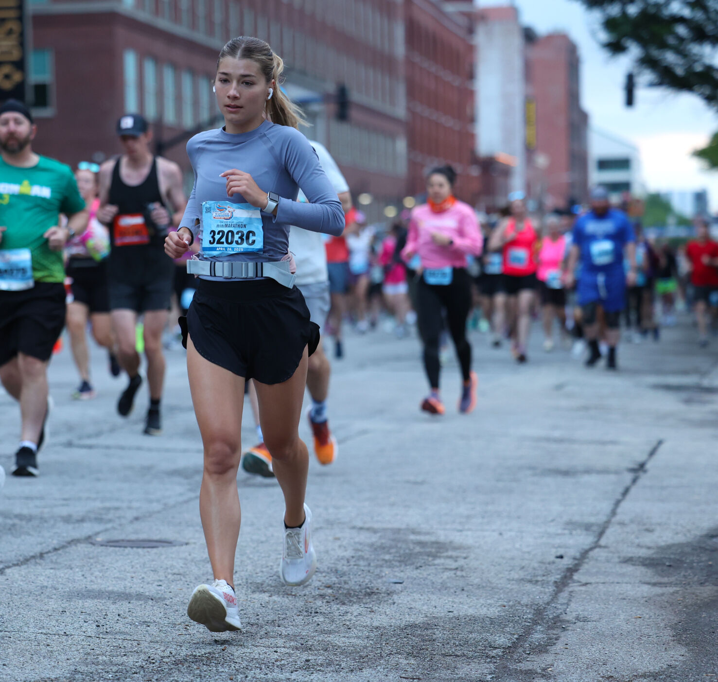 Female runner competes in marathon.JPG